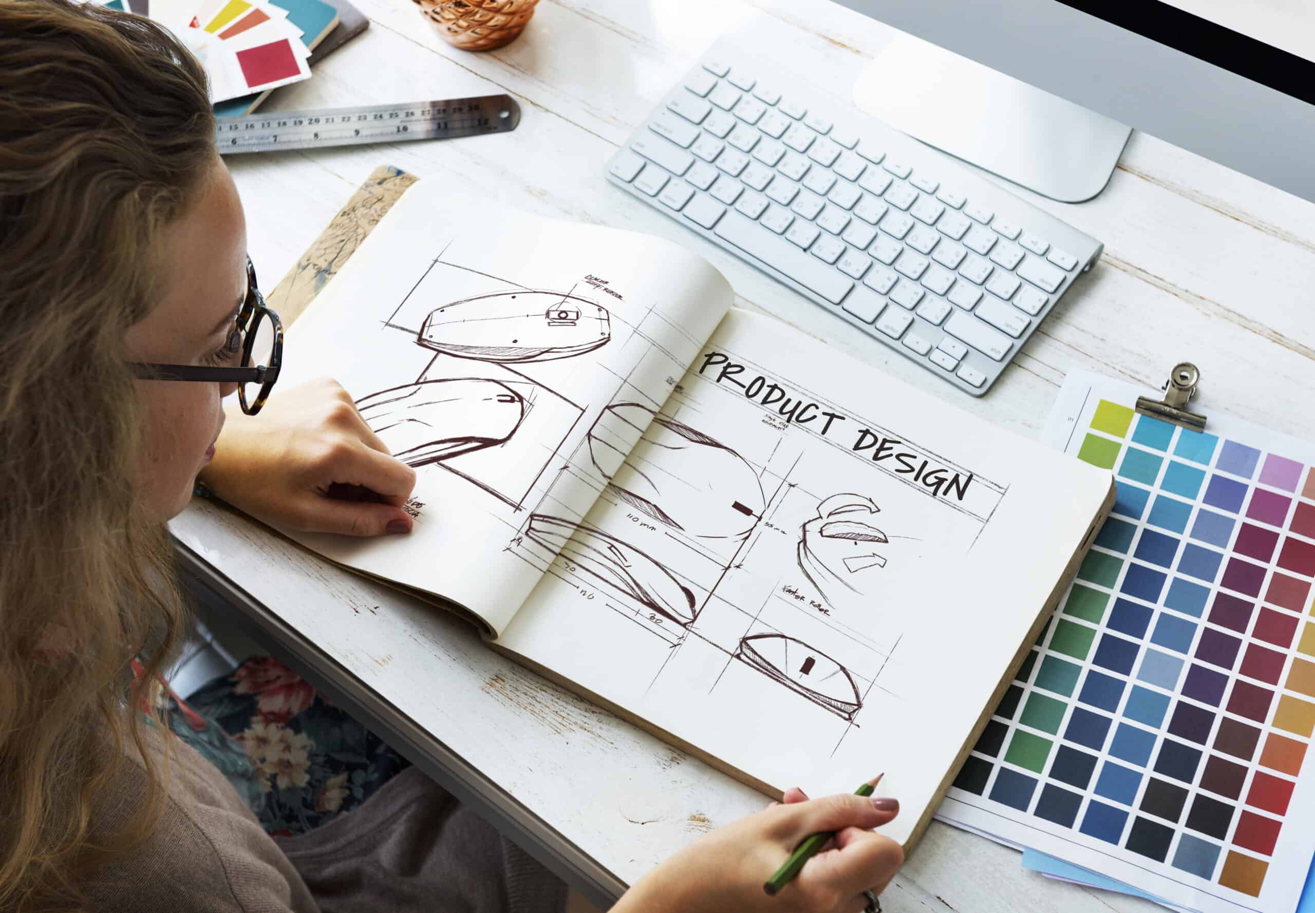 designer with sketch book creative logo design